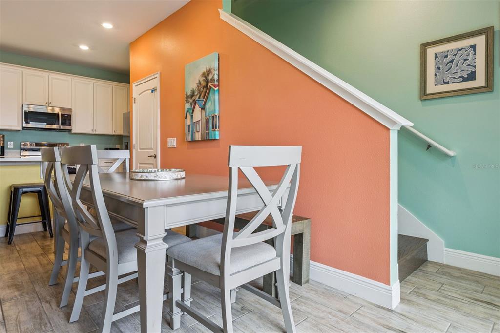 2949 Caribbean Soul Drive Kissimmee, FL 34747 - Photo 14 of 88 a dining room with furniture and wooden floor