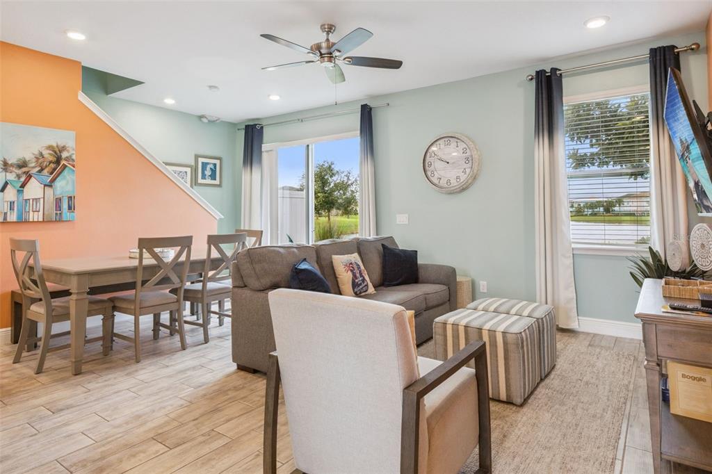 2949 Caribbean Soul Drive Kissimmee, FL 34747 - Photo 16 of 88 a living room with furniture a window and wooden floor