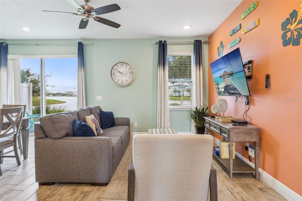 2949 Caribbean Soul Drive Kissimmee, FL 34747 - Photo 17 of 88 a living room with furniture and a large window