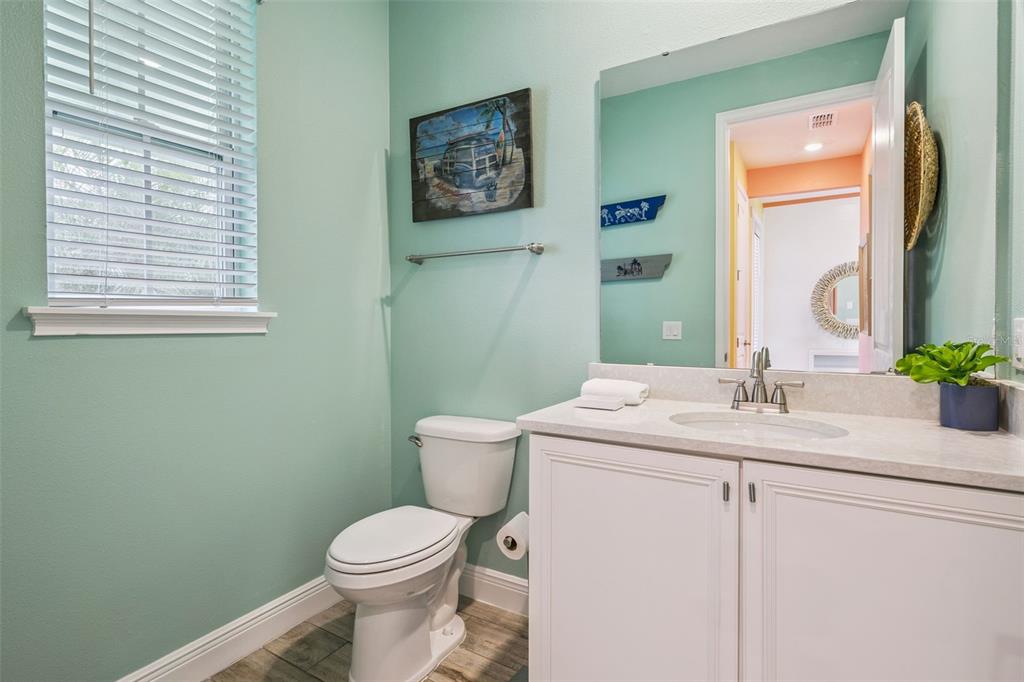 2949 Caribbean Soul Drive Kissimmee, FL 34747 - Photo 20 of 88 a bathroom with a toilet sink and mirror