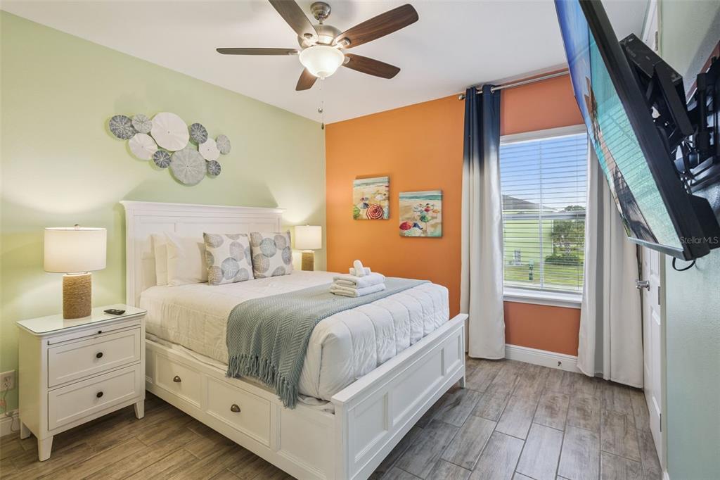 2949 Caribbean Soul Drive Kissimmee, FL 34747 - Photo 26 of 88 a bedroom with a large bed and a window