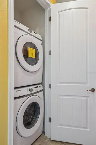 an aerial view of multiple houses with a yard