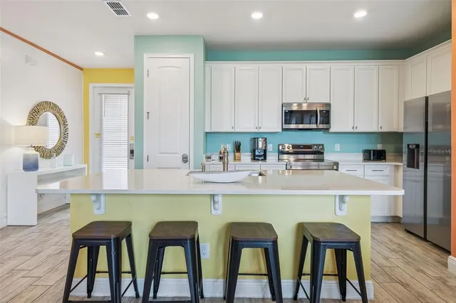 a dining room with furniture and wooden floor