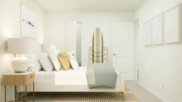 a bedroom with a bed and a painting on the wall