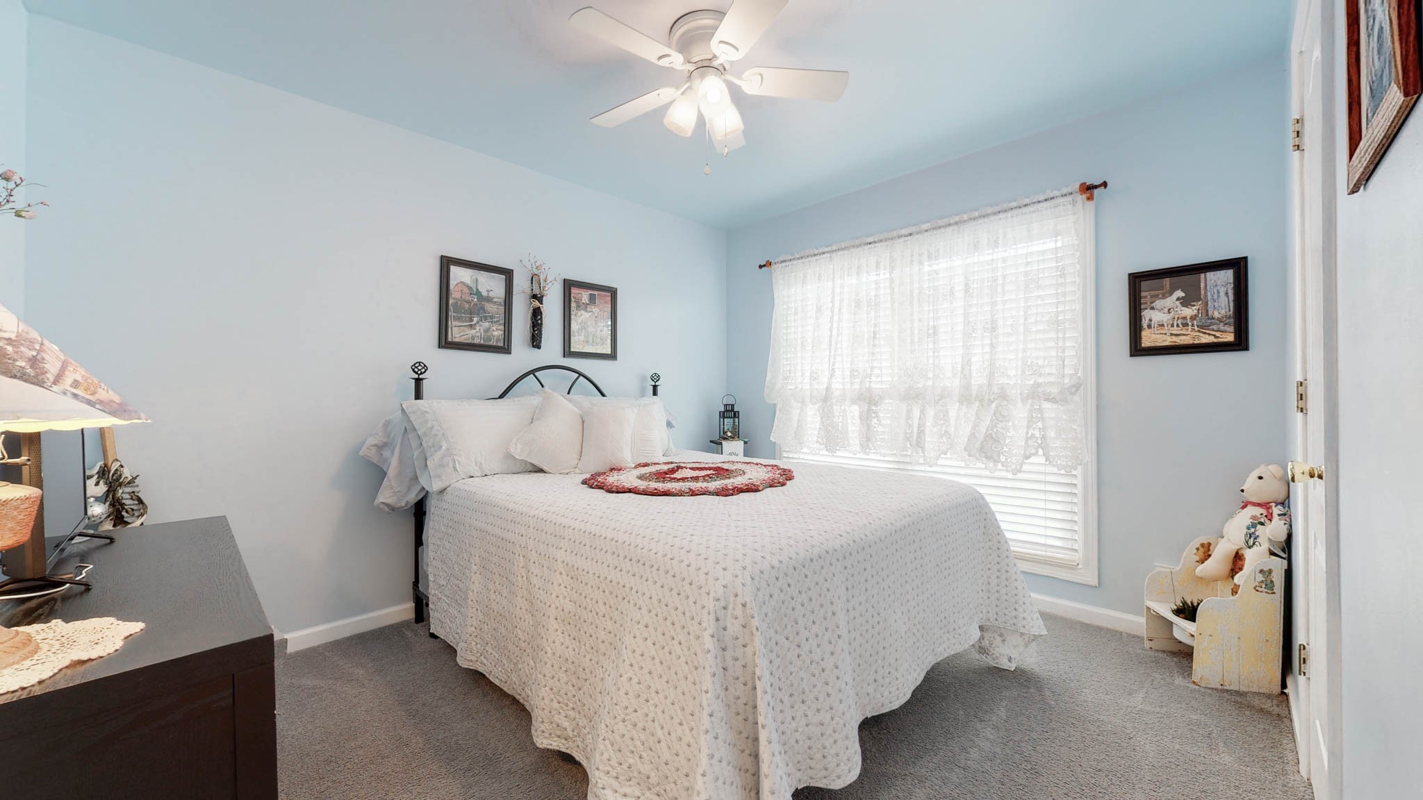 1212 Hunters Point Lane Spring Hill, TN 37174 - Photo 54 of 62 a bedroom with a bed and a chandelier