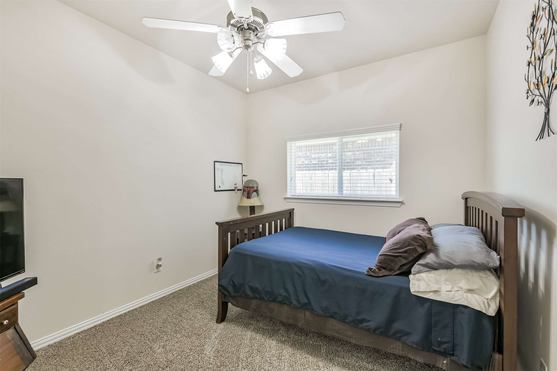 7527 Windsor Valley Lane Houston, TX 77049 - Photo 31 of 35 a bedroom with a bed and window