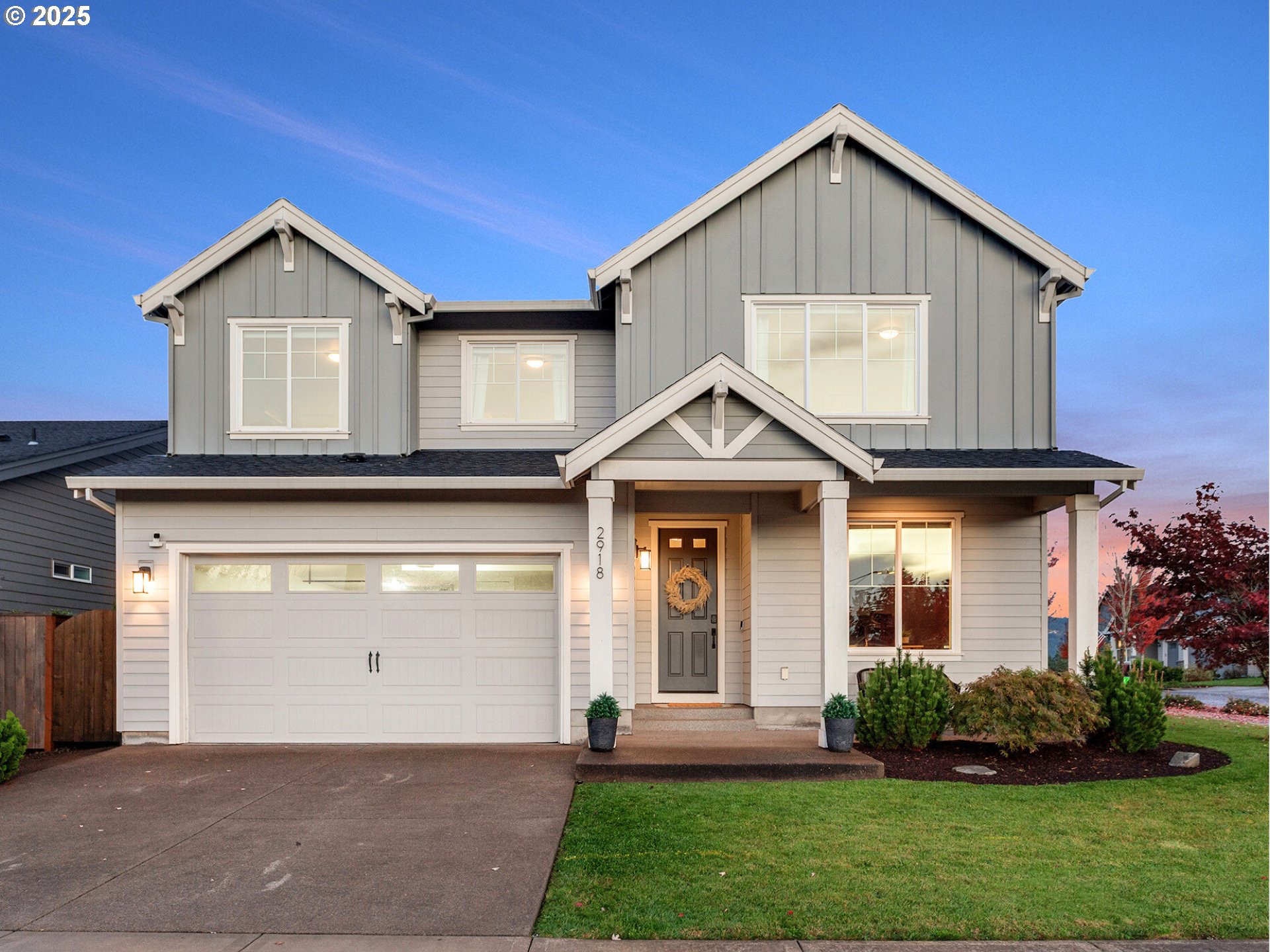 2918 Juniper Drive Newberg, OR 97132 - Photo 1 of 42 a front view of a house with a yard and garage