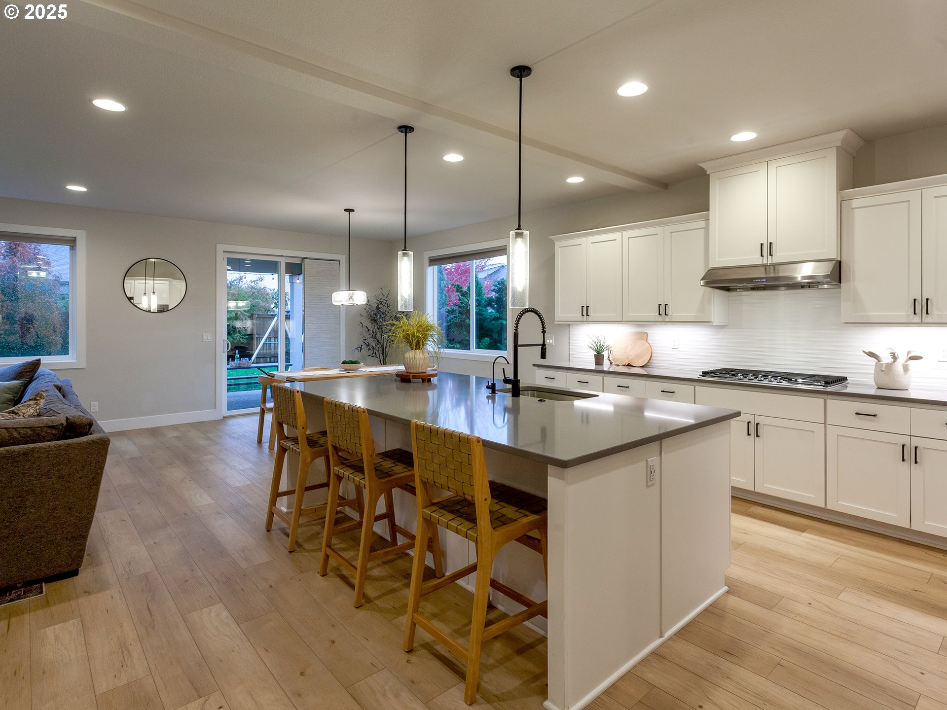 2918 Juniper Drive Newberg, OR 97132 - Photo 12 of 42 a kitchen with stainless steel appliances kitchen island granite countertop a sink and cabinets
