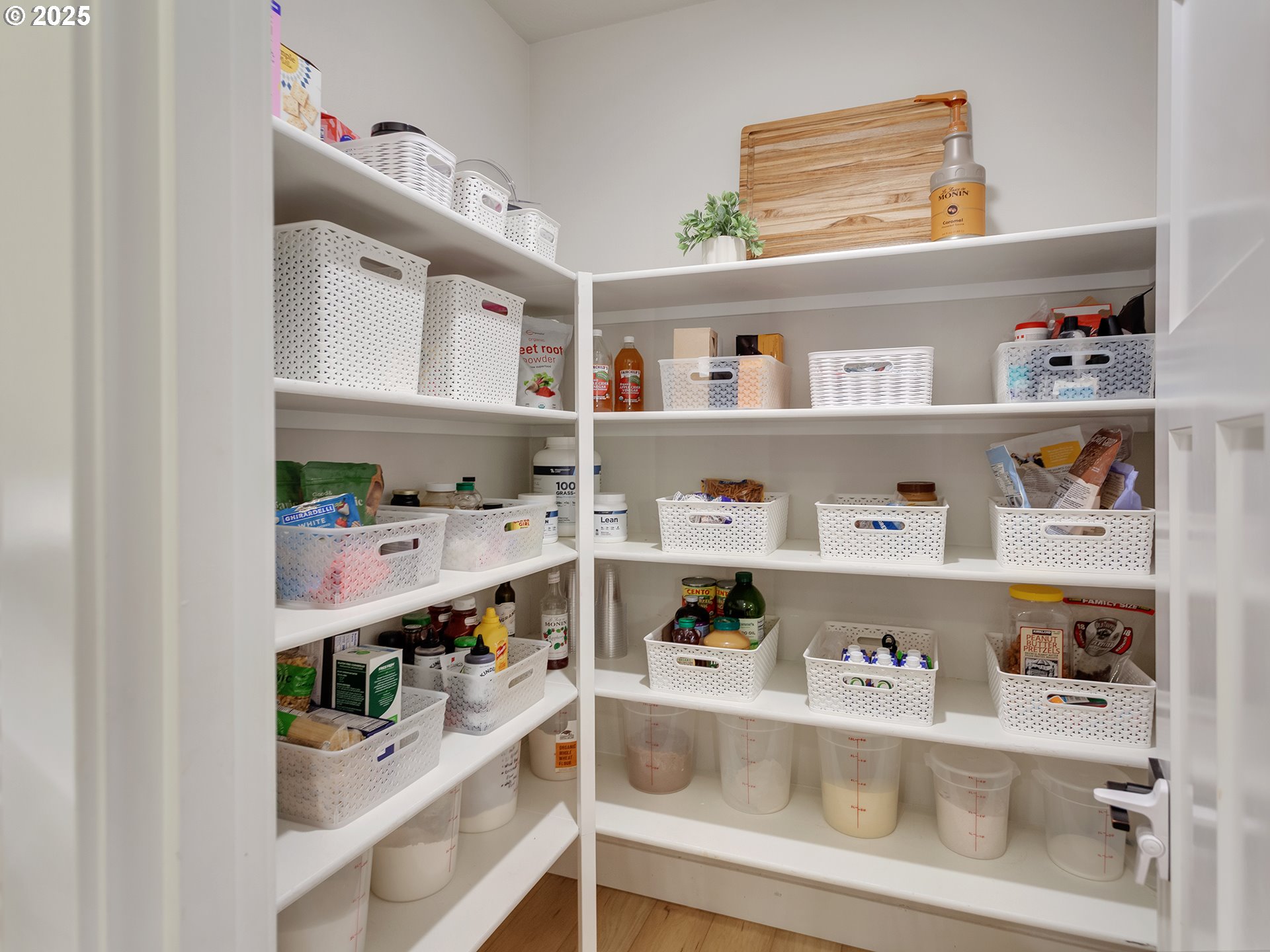 2918 Juniper Drive Newberg, OR 97132 - Photo 17 of 42 a cabinet with food and a book shelf