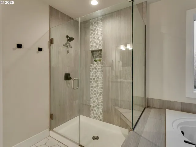 a bathroom with a shower and a sink