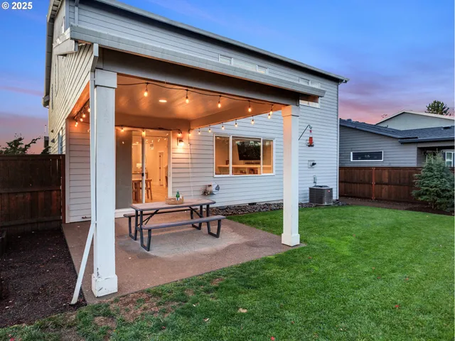a view of backyard with patio