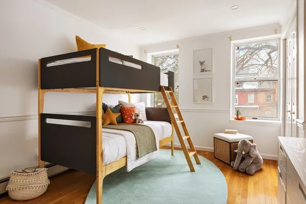 a bedroom with a bed and a couch