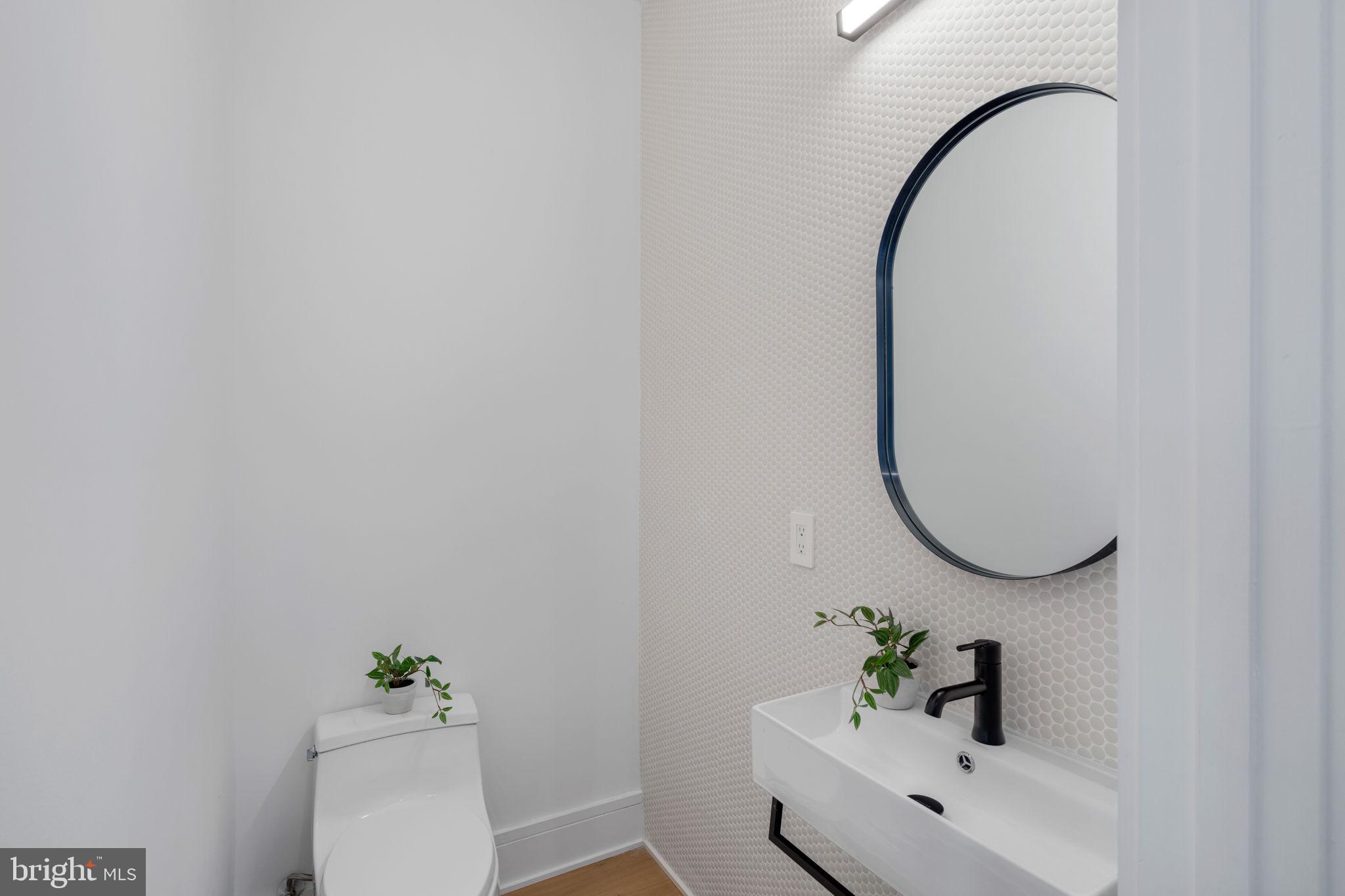 249 Philip Way Philadelphia, PA 19106 - Photo 21 of 61 a bathroom with a sink mirror and toilet