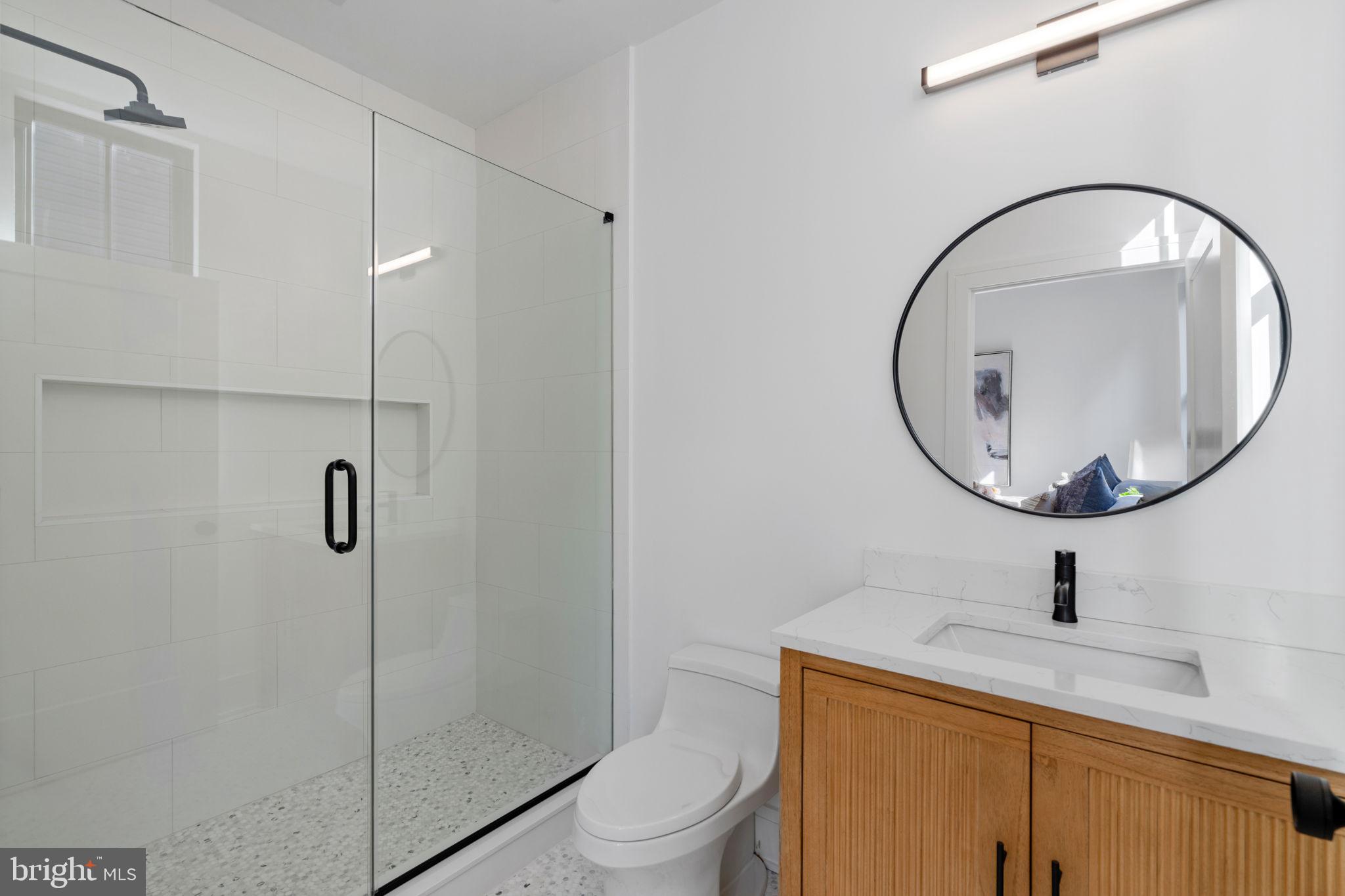 249 Philip Way Philadelphia, PA 19106 - Photo 31 of 61 a bathroom with a sink a toilet and a mirror
