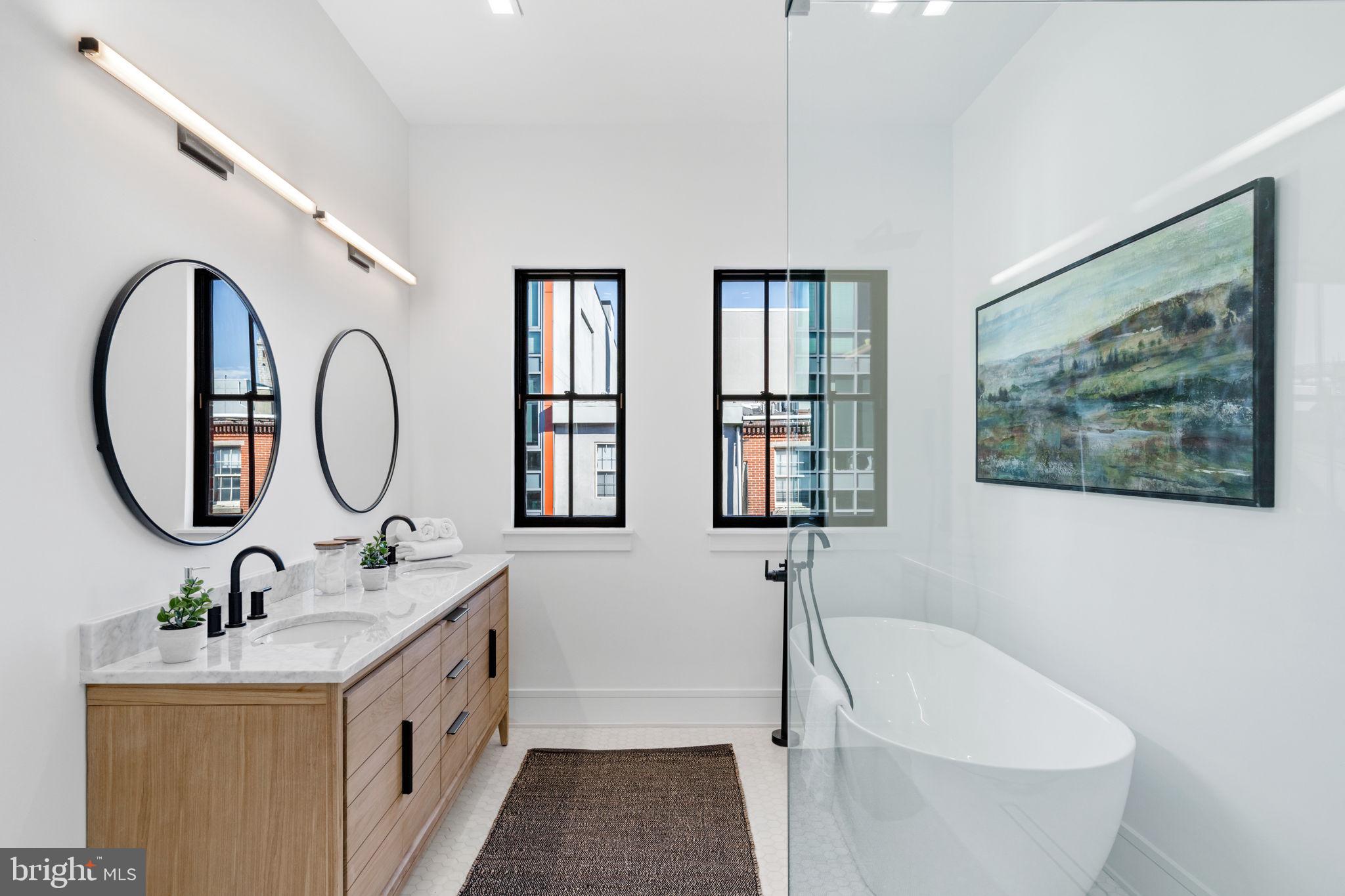 249 Philip Way Philadelphia, PA 19106 - Photo 41 of 61 a bathroom with a granite countertop sink mirror and bathtub