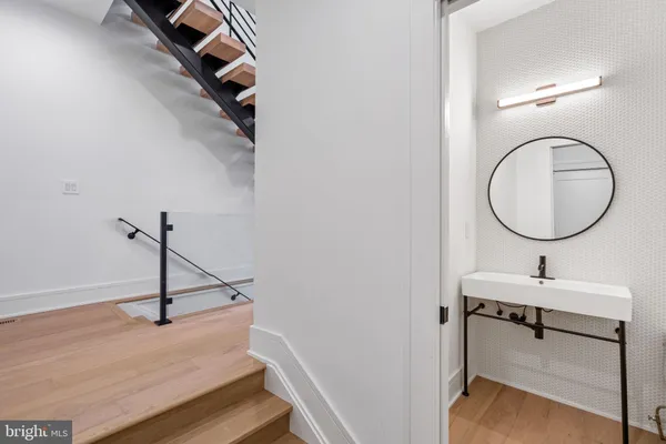 a bathroom with a sink and a mirror