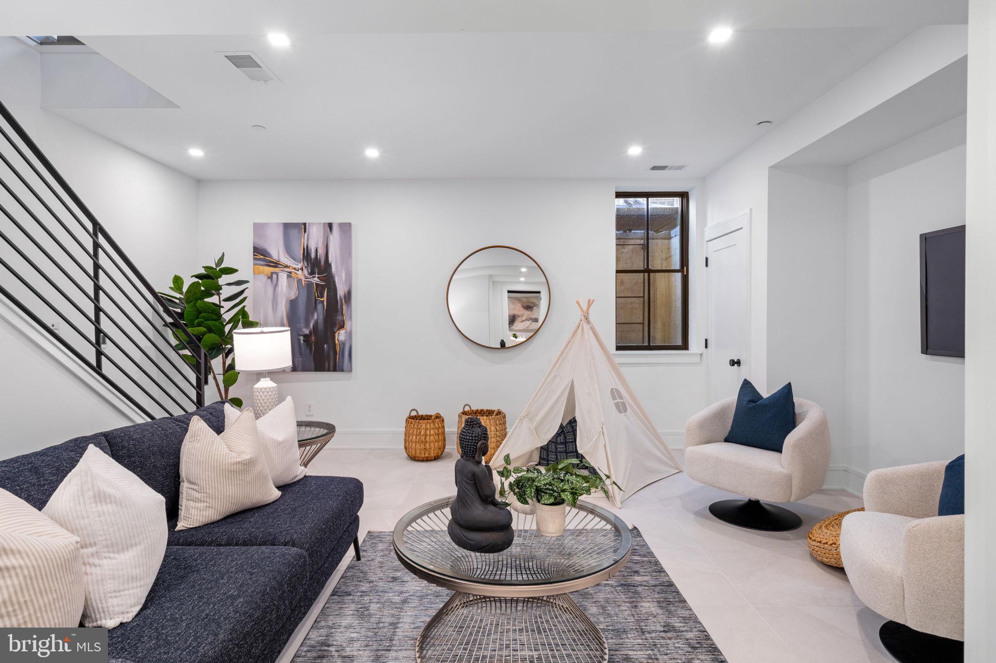 249 Philip Way Philadelphia, PA 19106 - Photo 54 of 61 a living room with furniture potted plant and white walls