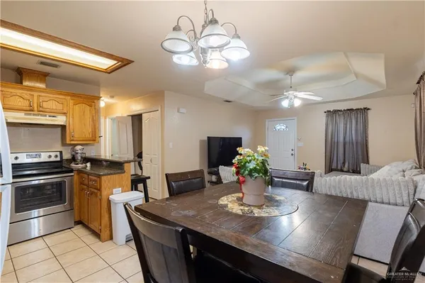 a kitchen with a table and chairs in it