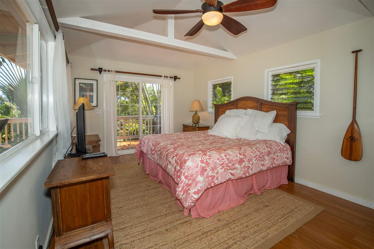 475 Haumana Road Haiku, HI 96708 - Photo 11 of 30 a bedroom with a bed dresser and a window