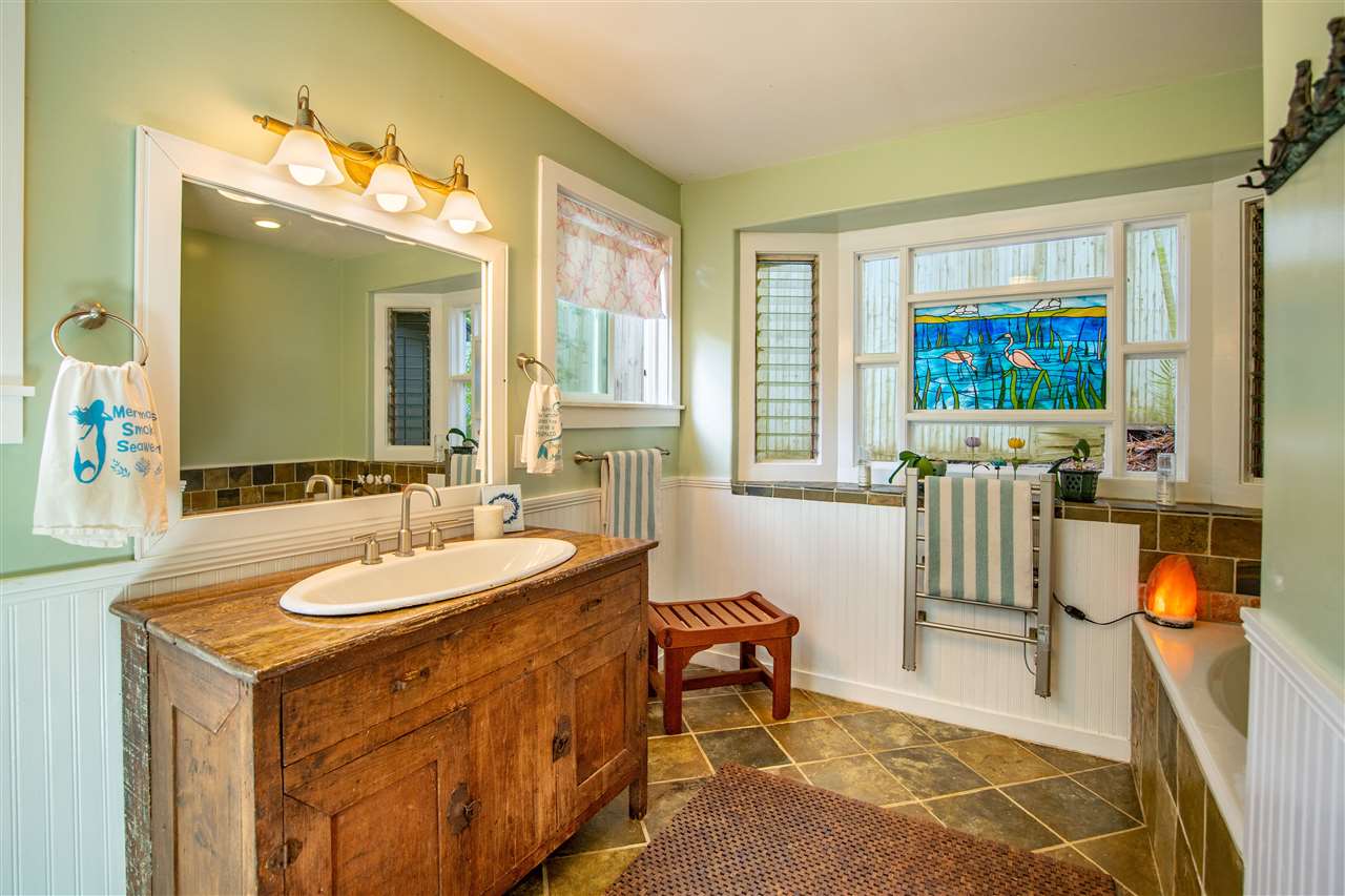 475 Haumana Road Haiku, HI 96708 - Photo 12 of 30 a spacious bathroom with a sink double vanity and a mirror