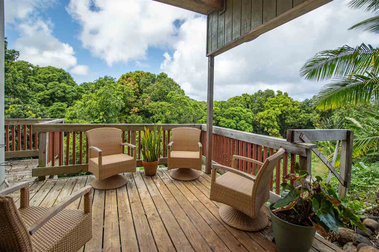 475 Haumana Road Haiku, HI 96708 - Photo 23 of 30 a view of a deck with furniture and a garden