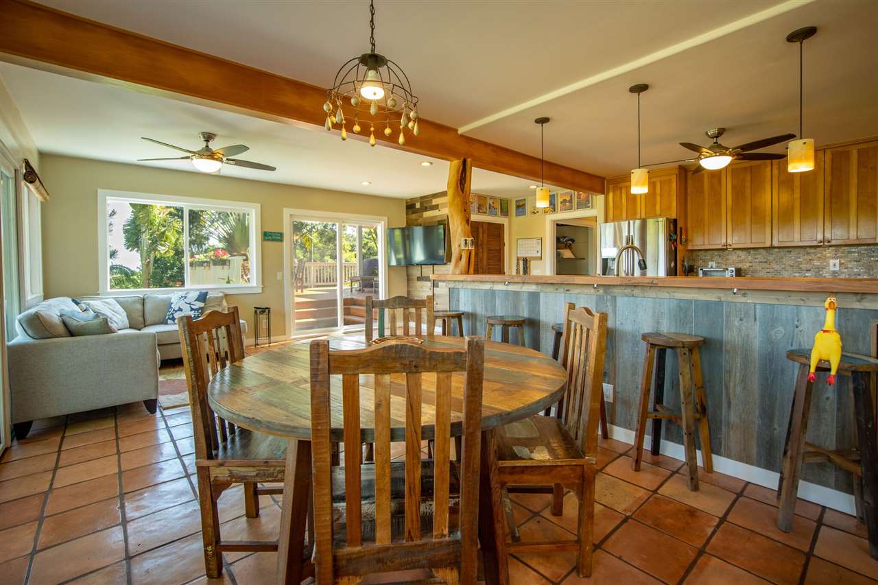 475 Haumana Road Haiku, HI 96708 - Photo 5 of 30 a dining room with furniture a chandelier and window