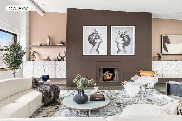 a dining room with lots of furniture and view of kitchen