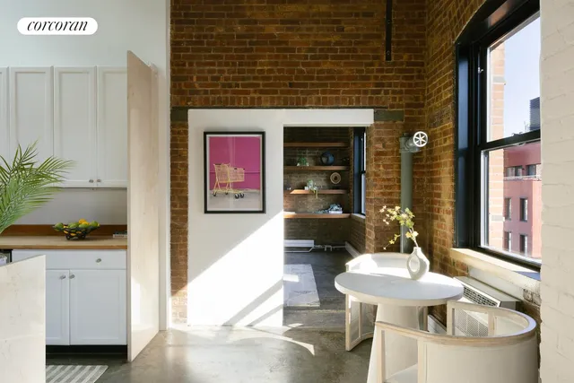 a bedroom with a bed lamp closet and large window