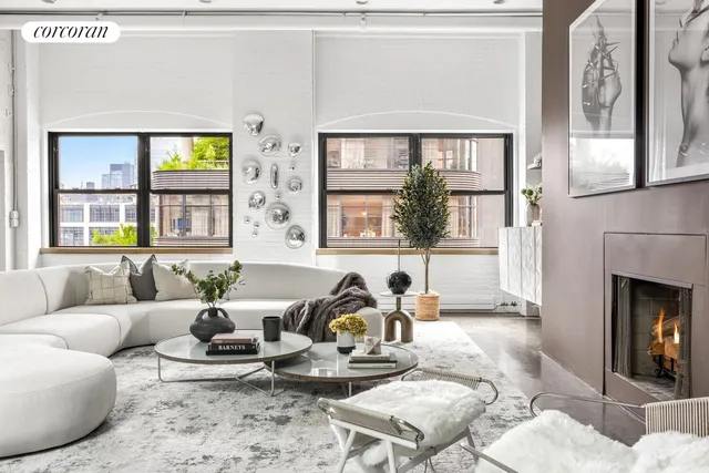a view of a room with furniture and wooden floor
