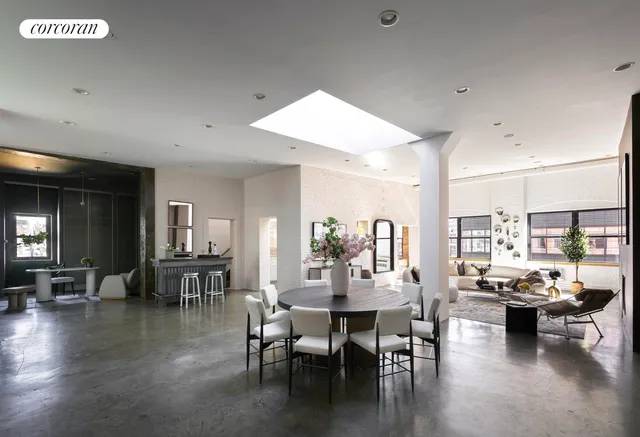 a view of a patio with couches and potted plants