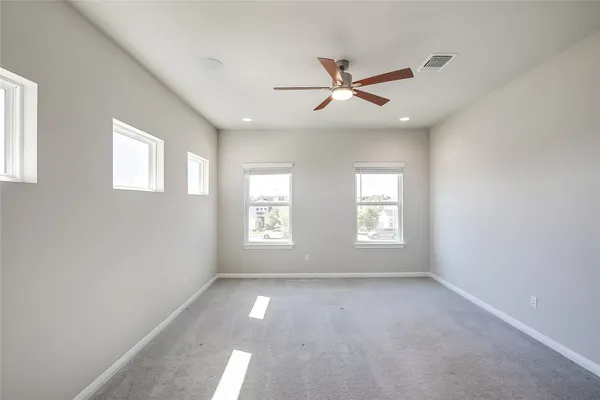 a view of empty room with windows