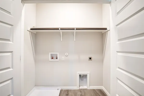 a view of kitchen with refrigerator