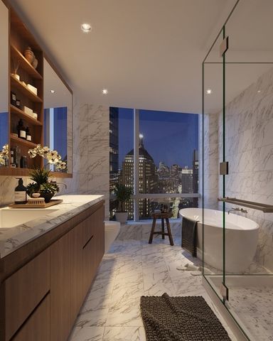 a kitchen with stainless steel appliances kitchen island granite countertop a sink and cabinets