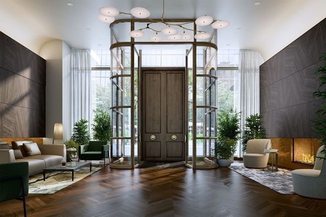 a lobby with furniture and a potted plant