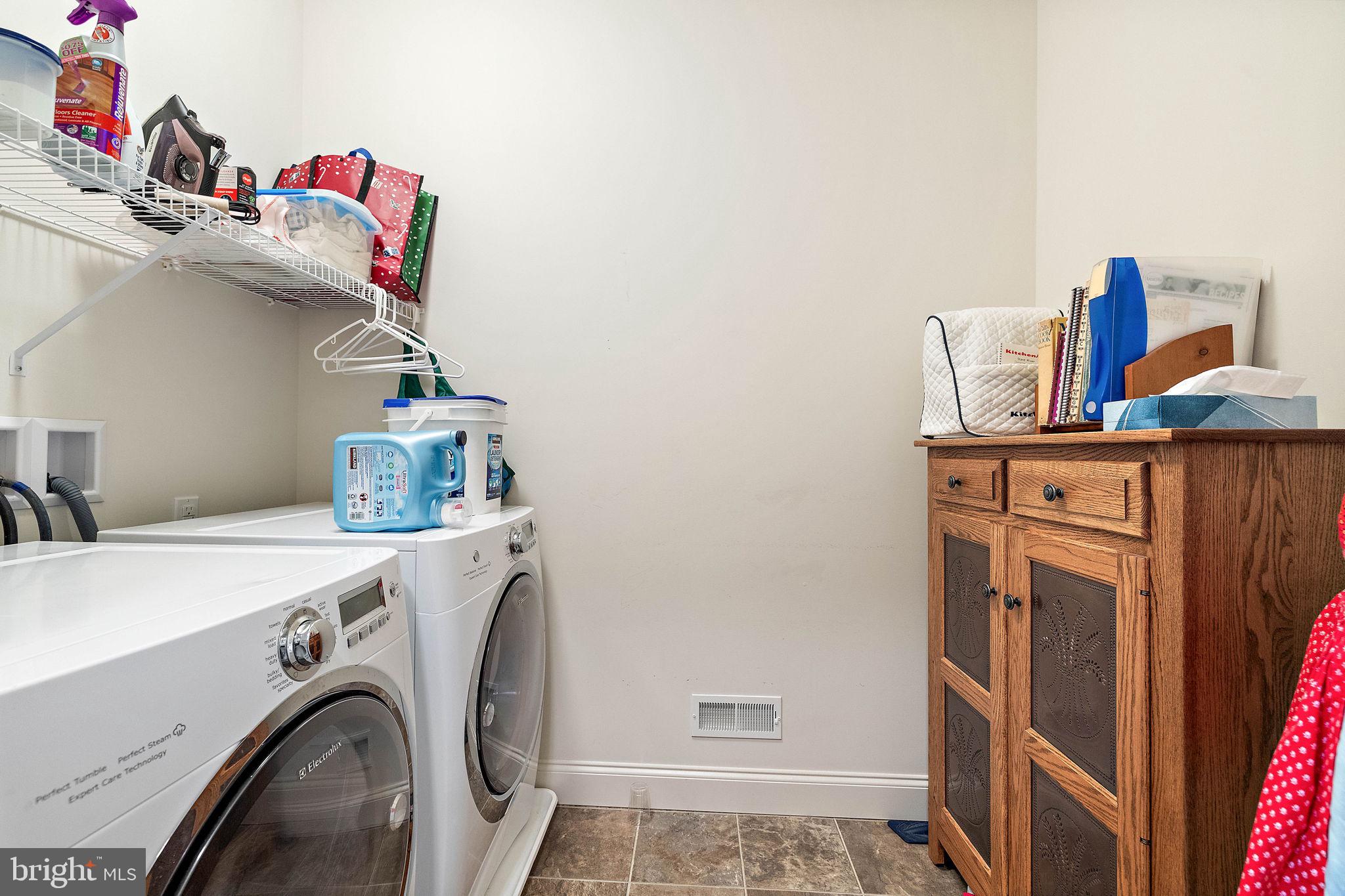 716 Bee Rdg Path Cochranville, PA 19330 - Photo 31 of 54 1st floor laundry near primary bedroom