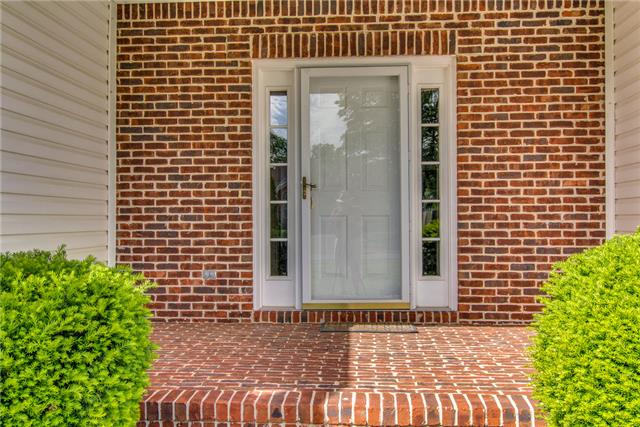 2062 Prescott Way Spring Hill, TN 37174 - Photo 2 of 20 This home has been meticulously maintained, beautifully landscaped and features a nice covered brick front porch.