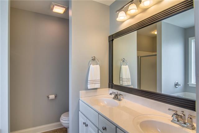 2062 Prescott Way Spring Hill, TN 37174 - Photo 11 of 20 Master bath with new faucet, lighting and custom framed mirror. The entire home is fresh in neutral designer colors.