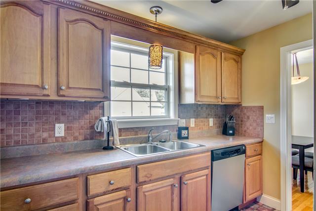 2062 Prescott Way Spring Hill, TN 37174 - Photo 8 of 20 Notice the long set of cabinets and window overlooking the back yard.