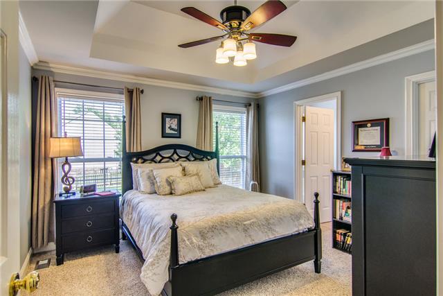 2062 Prescott Way Spring Hill, TN 37174 - Photo 10 of 20 Master bedroom in designer colors with newer carpet and ceiling fan. There is a spacious walk in closet in the corner.