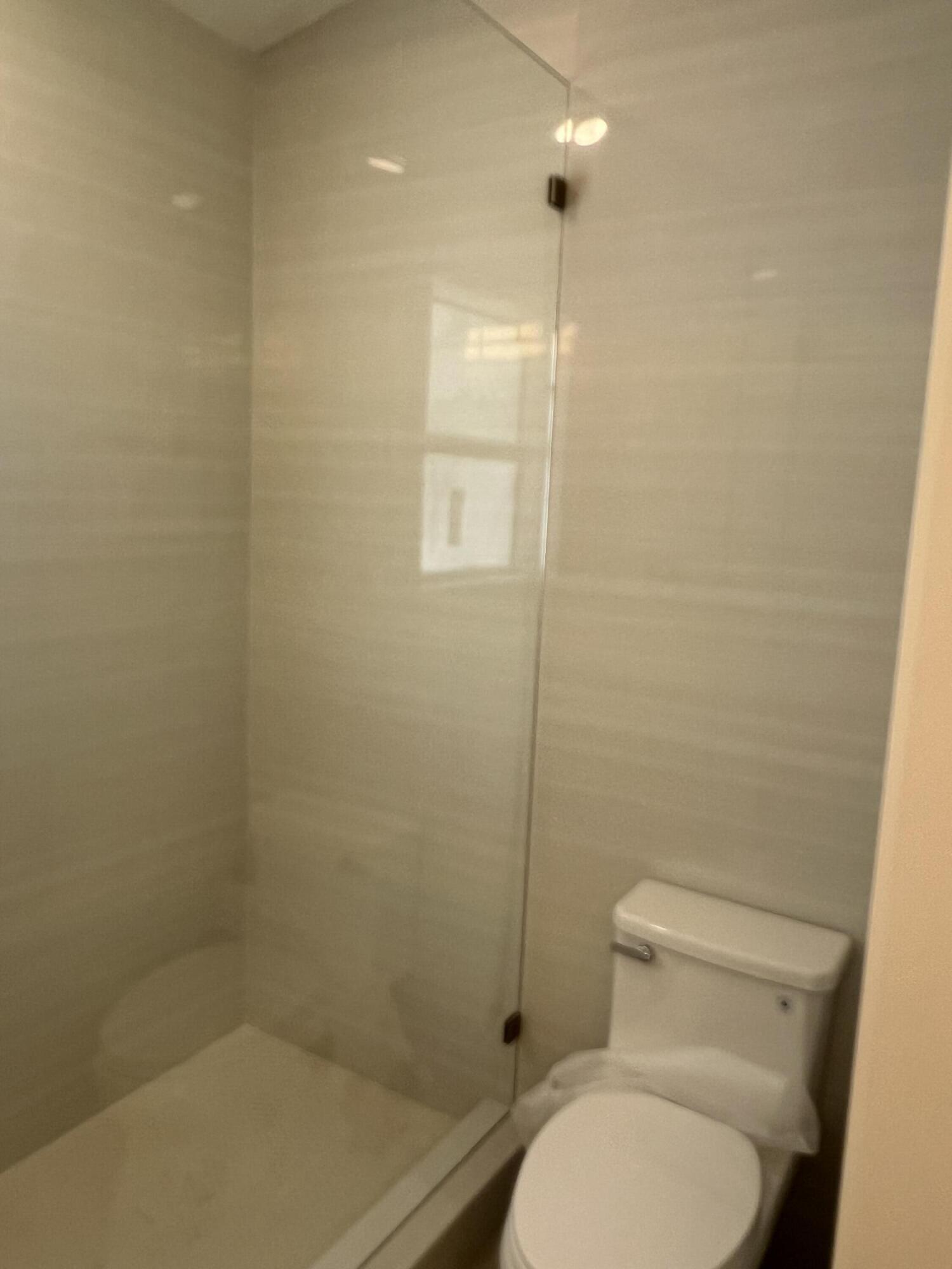 328 Nottingham Boulevard West Palm Beach, FL 33405 - Photo 14 of 22 a bathroom with a toilet and a shower