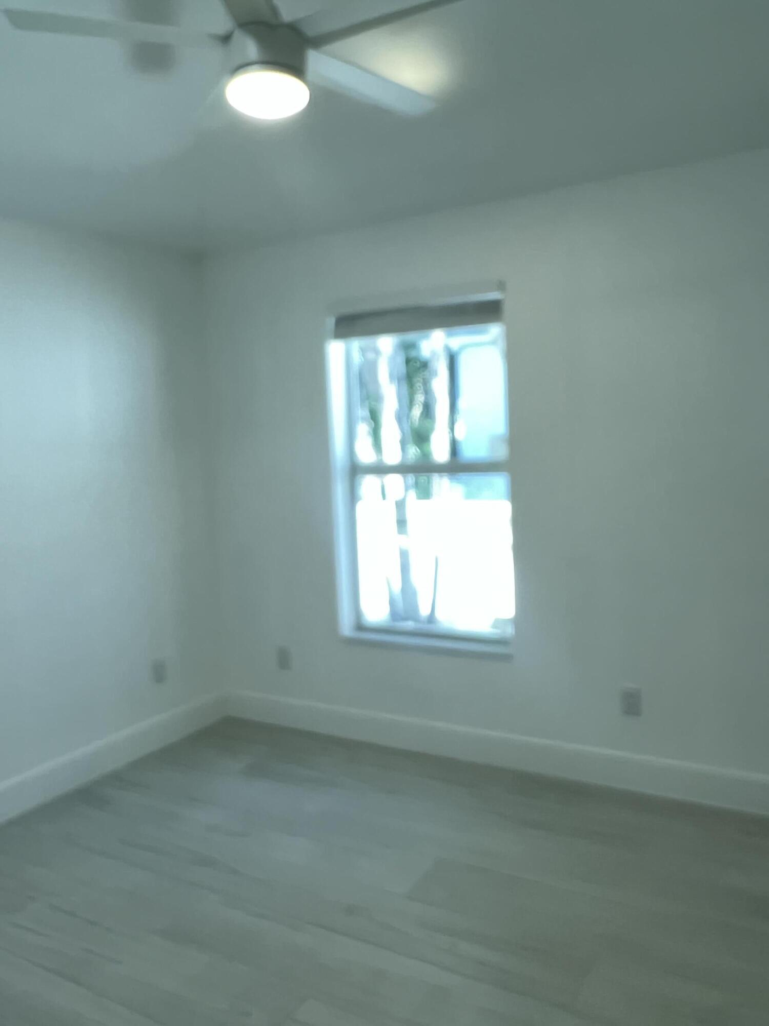 328 Nottingham Boulevard West Palm Beach, FL 33405 - Photo 15 of 22 an empty room with a window