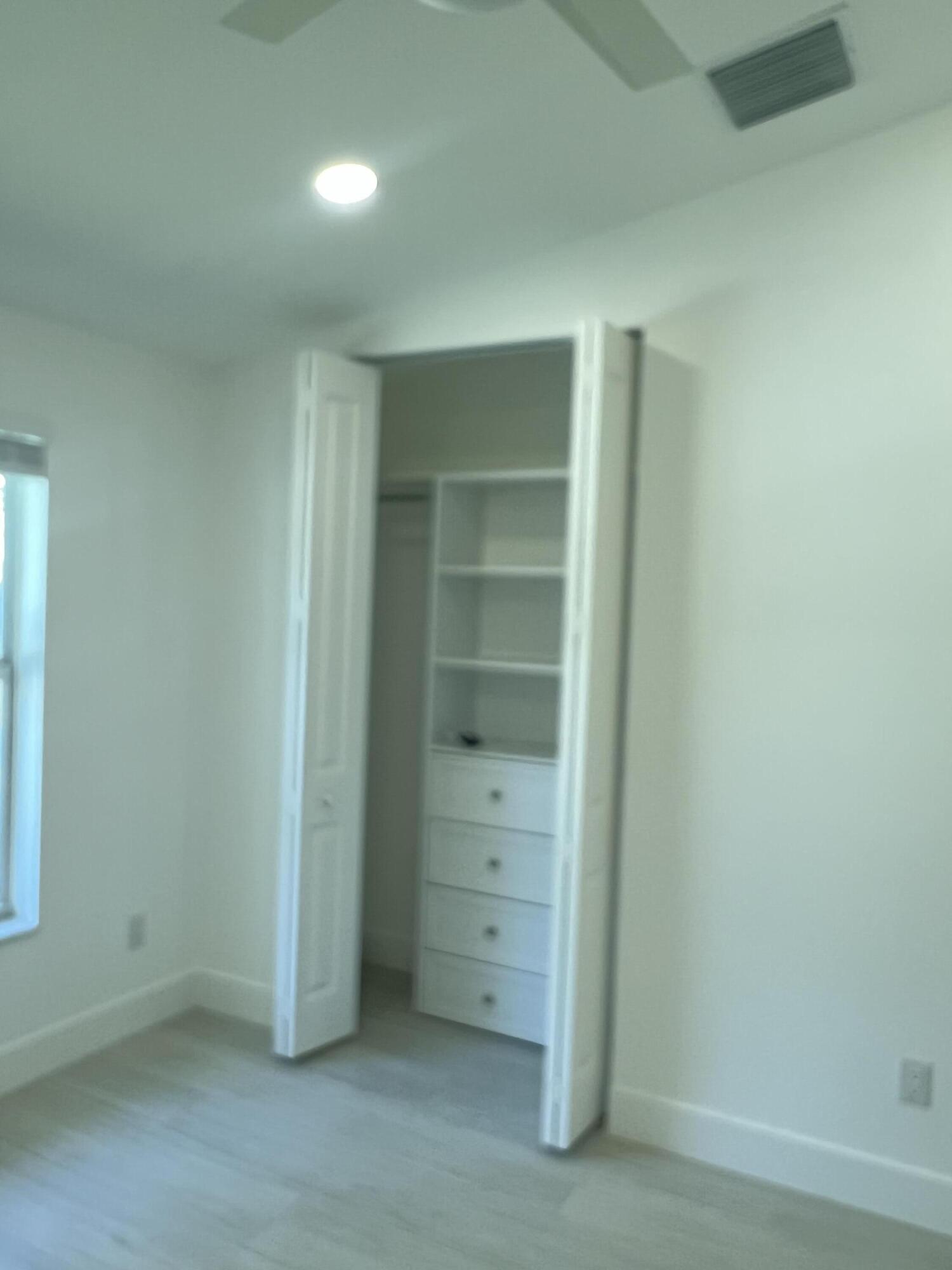 328 Nottingham Boulevard West Palm Beach, FL 33405 - Photo 16 of 22 an empty room with closet