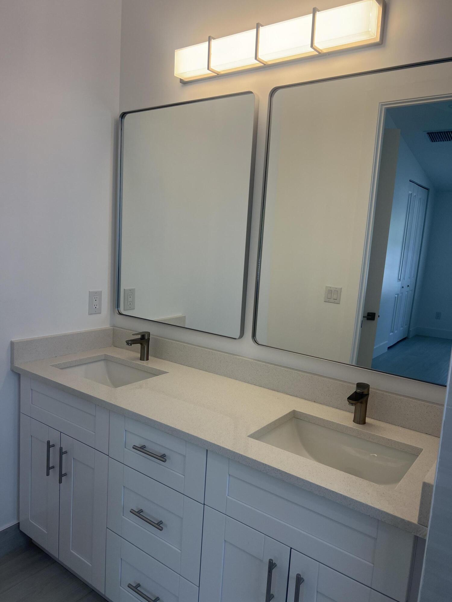 328 Nottingham Boulevard West Palm Beach, FL 33405 - Photo 19 of 22 a bathroom with a sink and a mirror