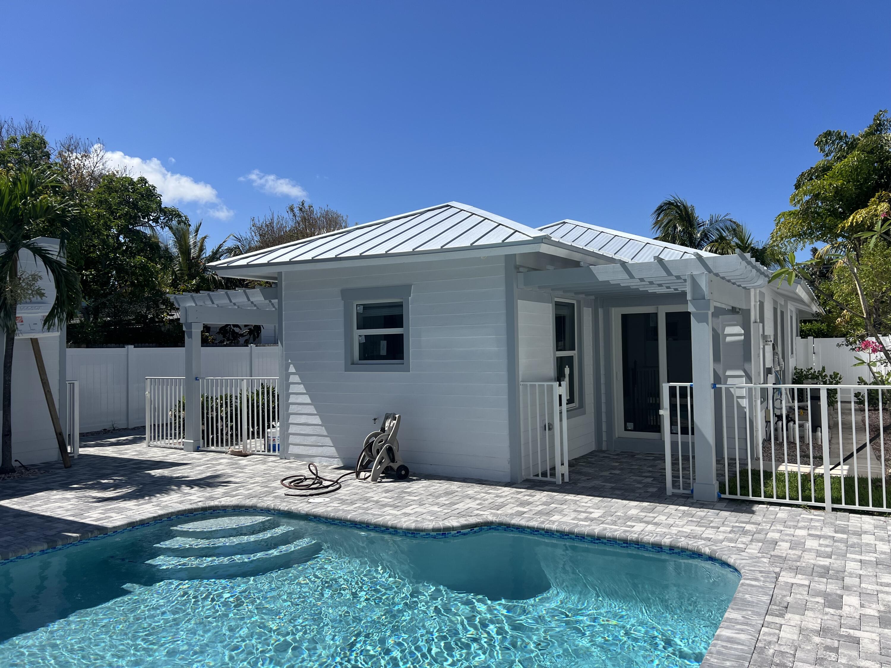 328 Nottingham Boulevard West Palm Beach, FL 33405 - Photo 5 of 22 a front view of a house with garden