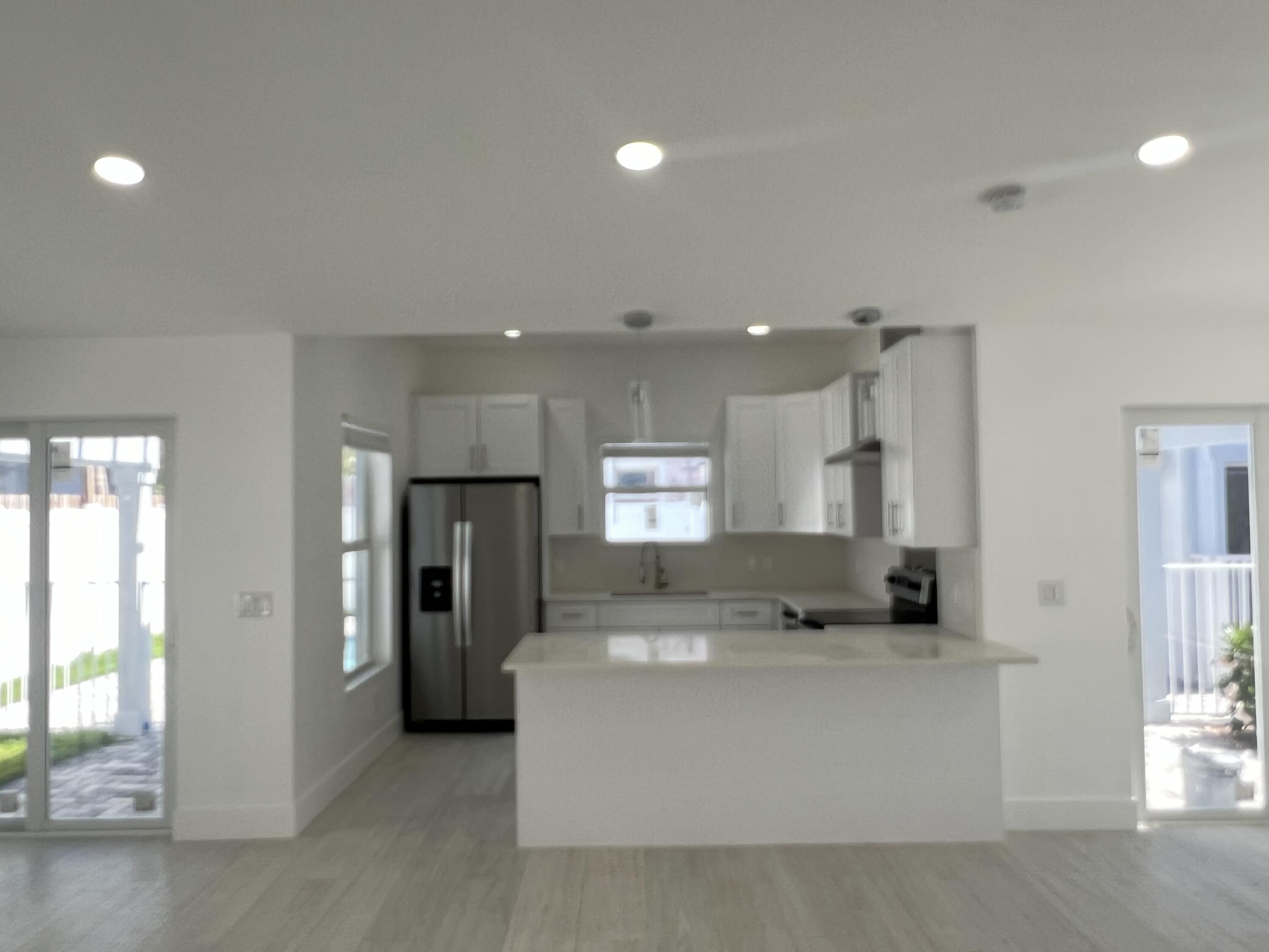 328 Nottingham Boulevard West Palm Beach, FL 33405 - Photo 7 of 22 a living room with stainless steel appliances kitchen island furniture and windows