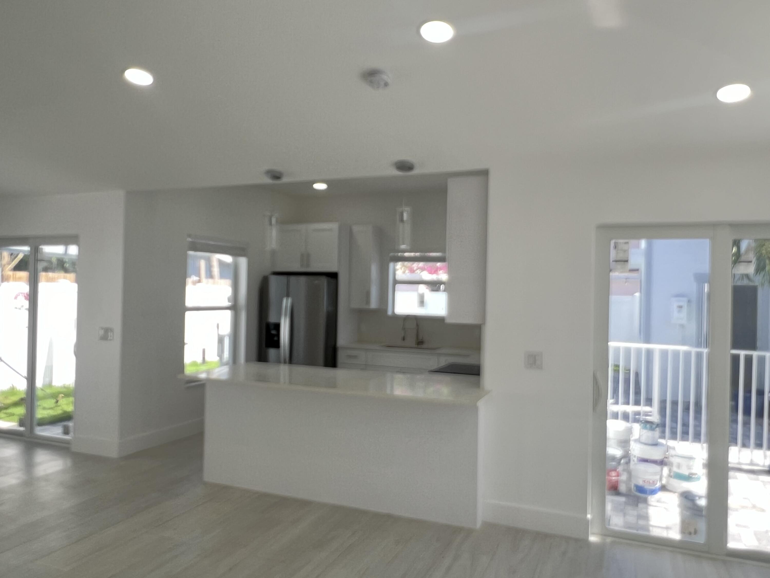 328 Nottingham Boulevard West Palm Beach, FL 33405 - Photo 9 of 22 a view of a hallway with wooden floor and a living room