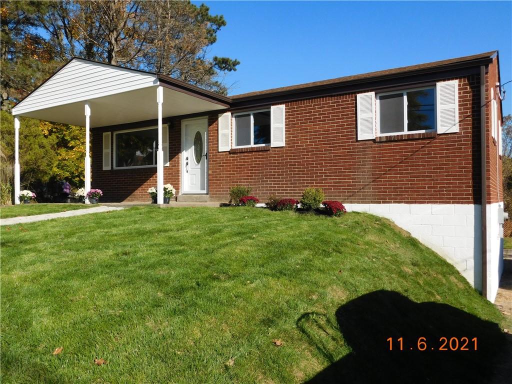 41 Highbury Road Cheswick, PA 15024 - Photo 2 of 19 a front view of a house with a yard