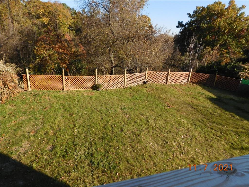 41 Highbury Road Cheswick, PA 15024 - Photo 15 of 19 a backyard of a house with lots of green space