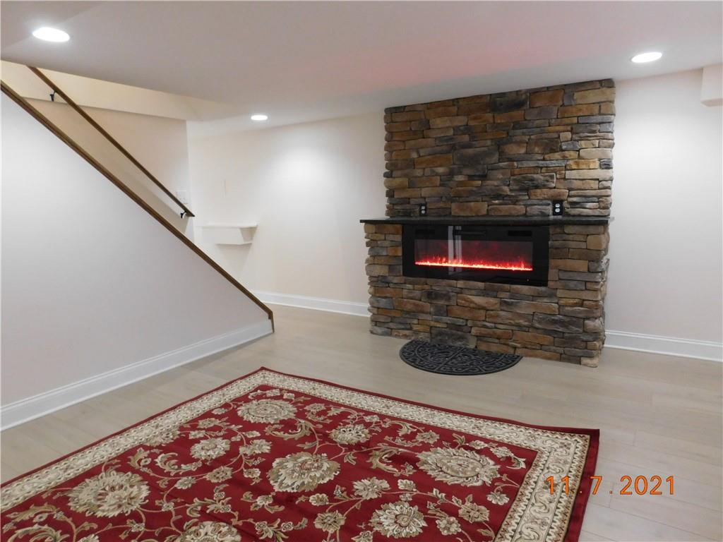 41 Highbury Road Cheswick, PA 15024 - Photo 17 of 19 a living room with a rug and a rug