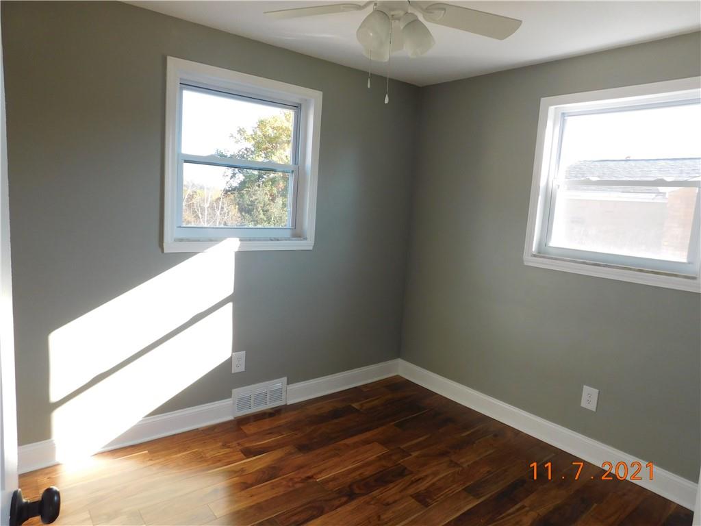 41 Highbury Road Cheswick, PA 15024 - Photo 3 of 19 a view of an empty room with wooden floor and a window